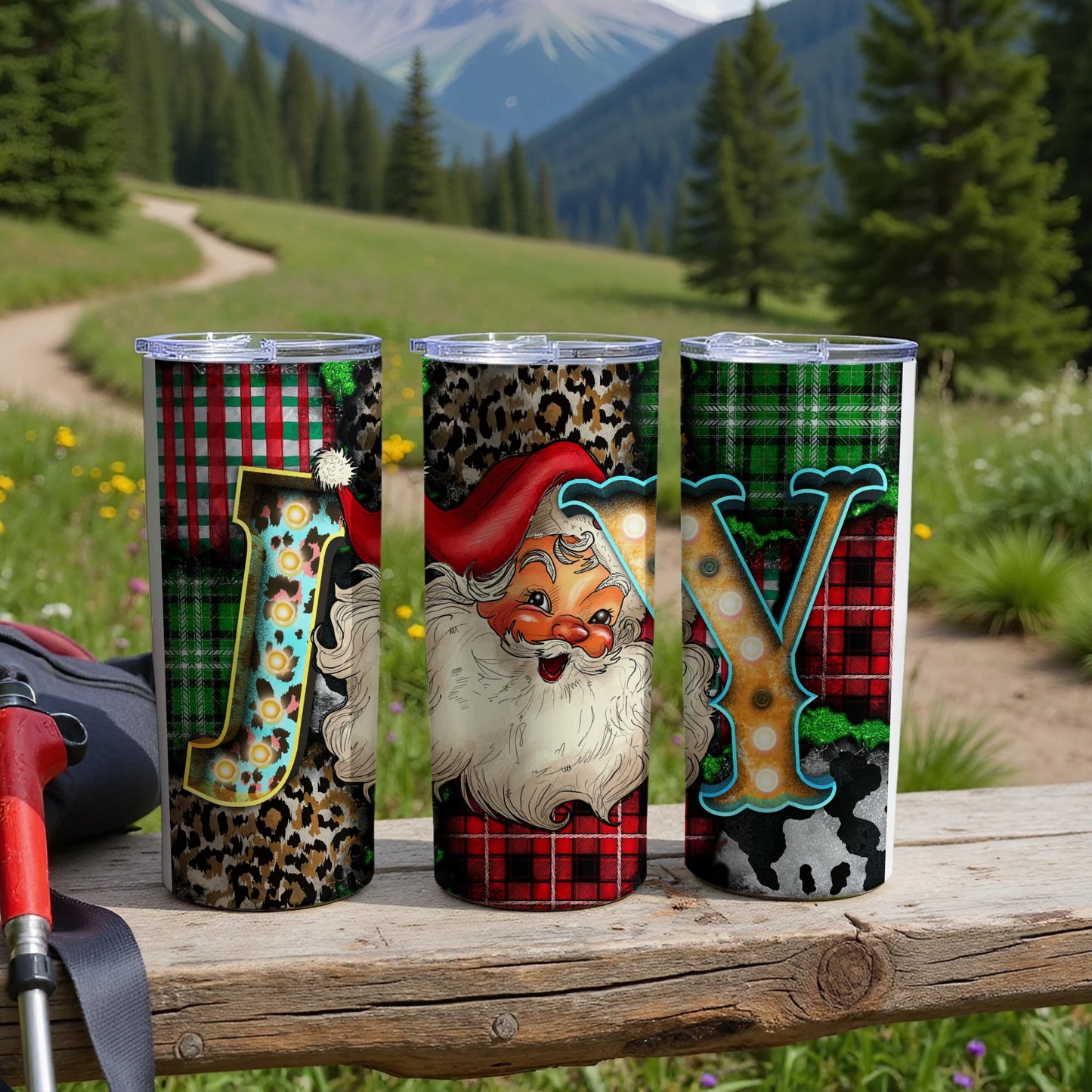 Three Christmas-themed tumblers with Santa, plaid, and leopard print designs.