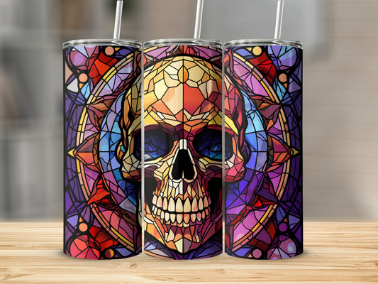 Stained glass skull tumbler with geometric purple and orange frame.