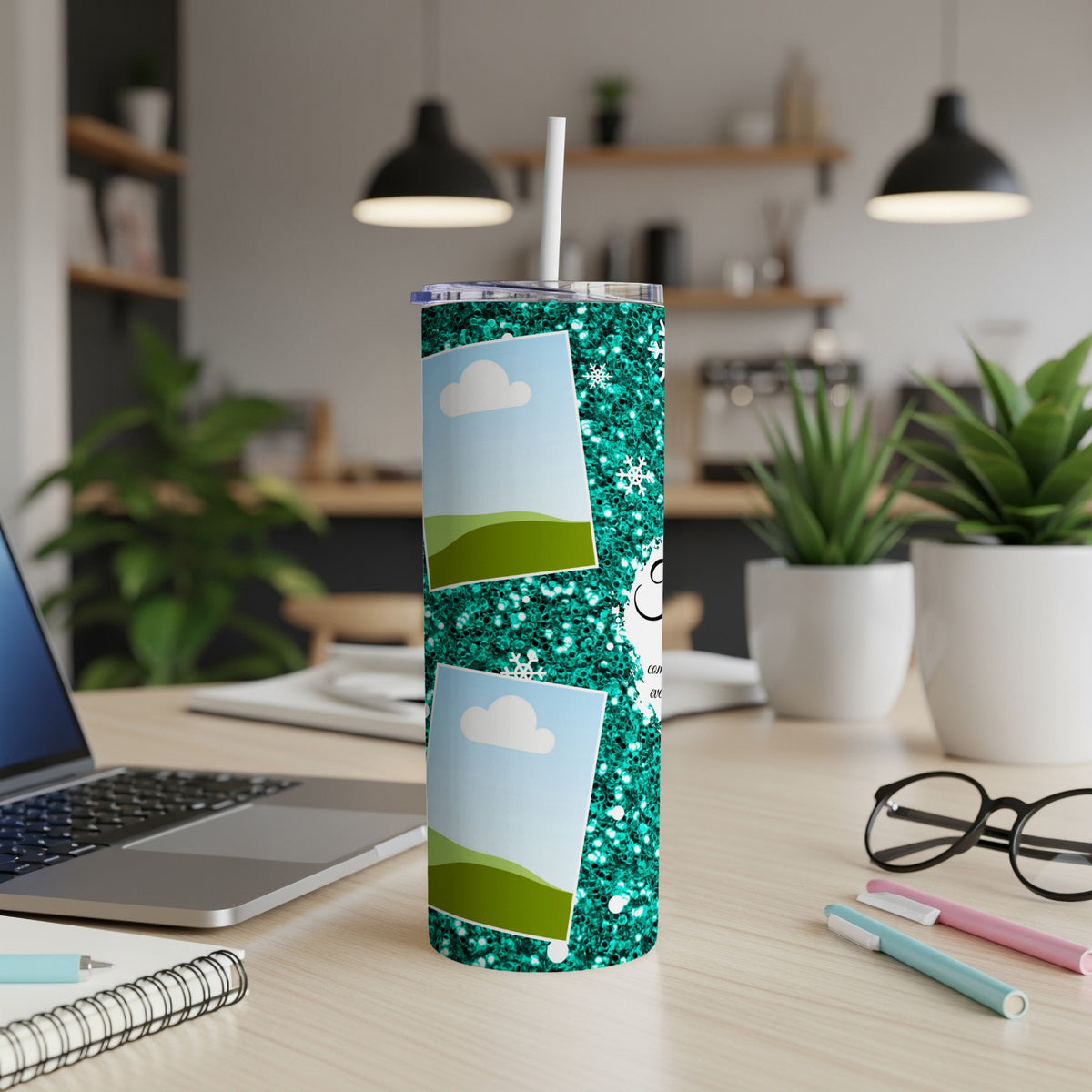 Teal glitter tumbler with photo frames and snowflakes, with a straw.