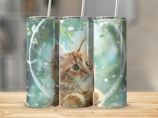 Orange tabby kitten with daisies in a circular frame.