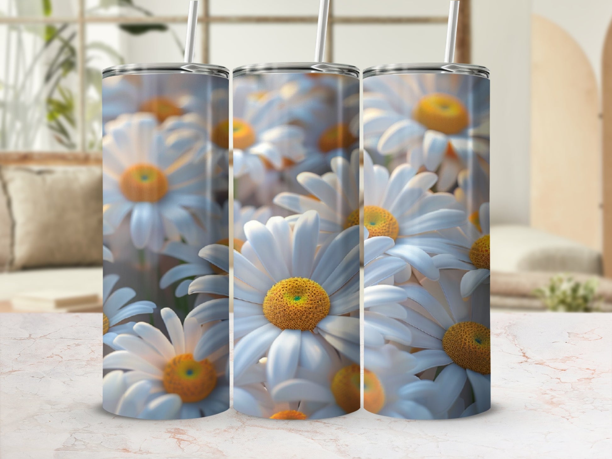 Three tumblers adorned with a close-up pattern of white daisies and yellow centers.