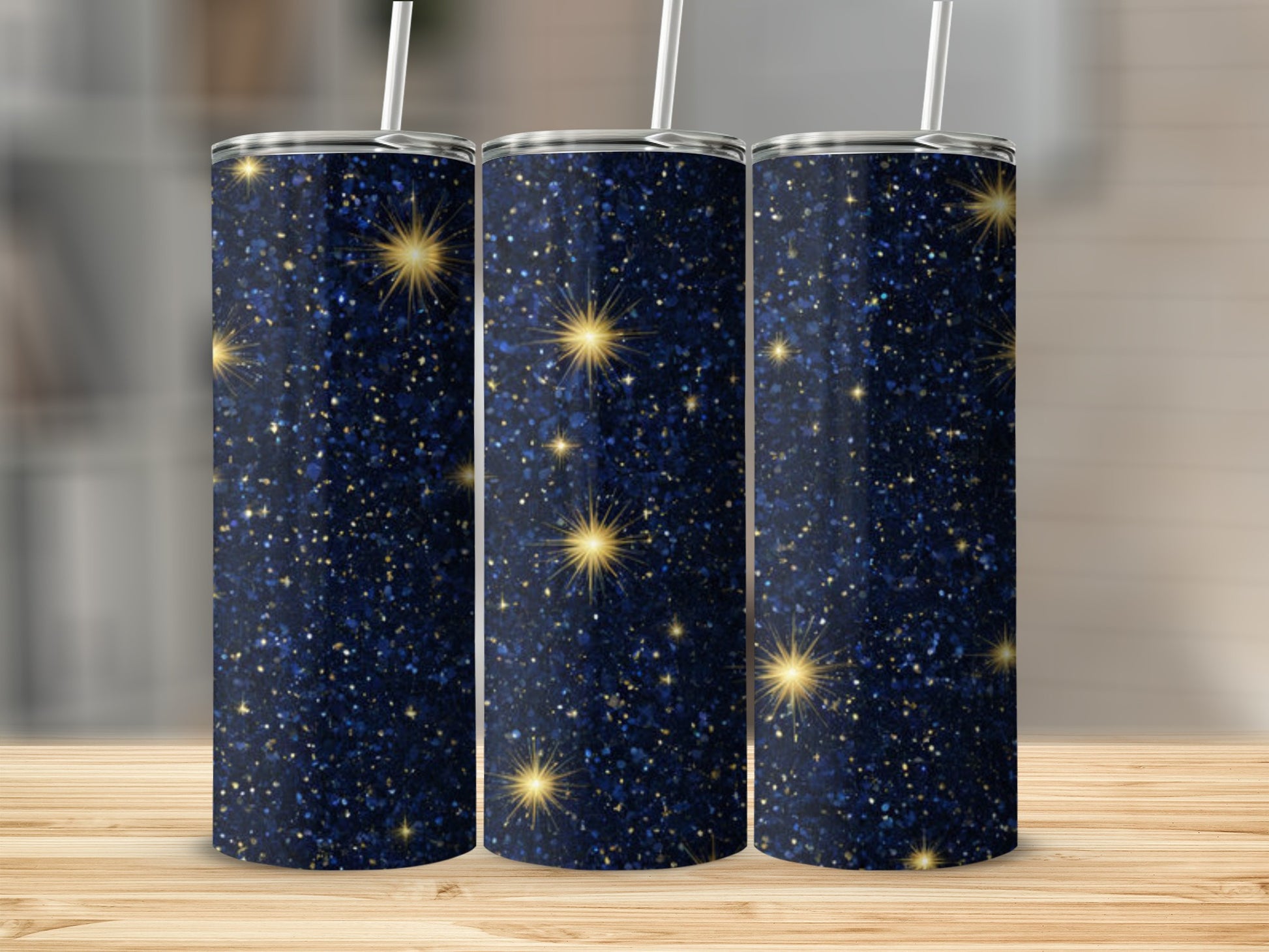 Dark blue tumbler with gold glitter and starbursts.