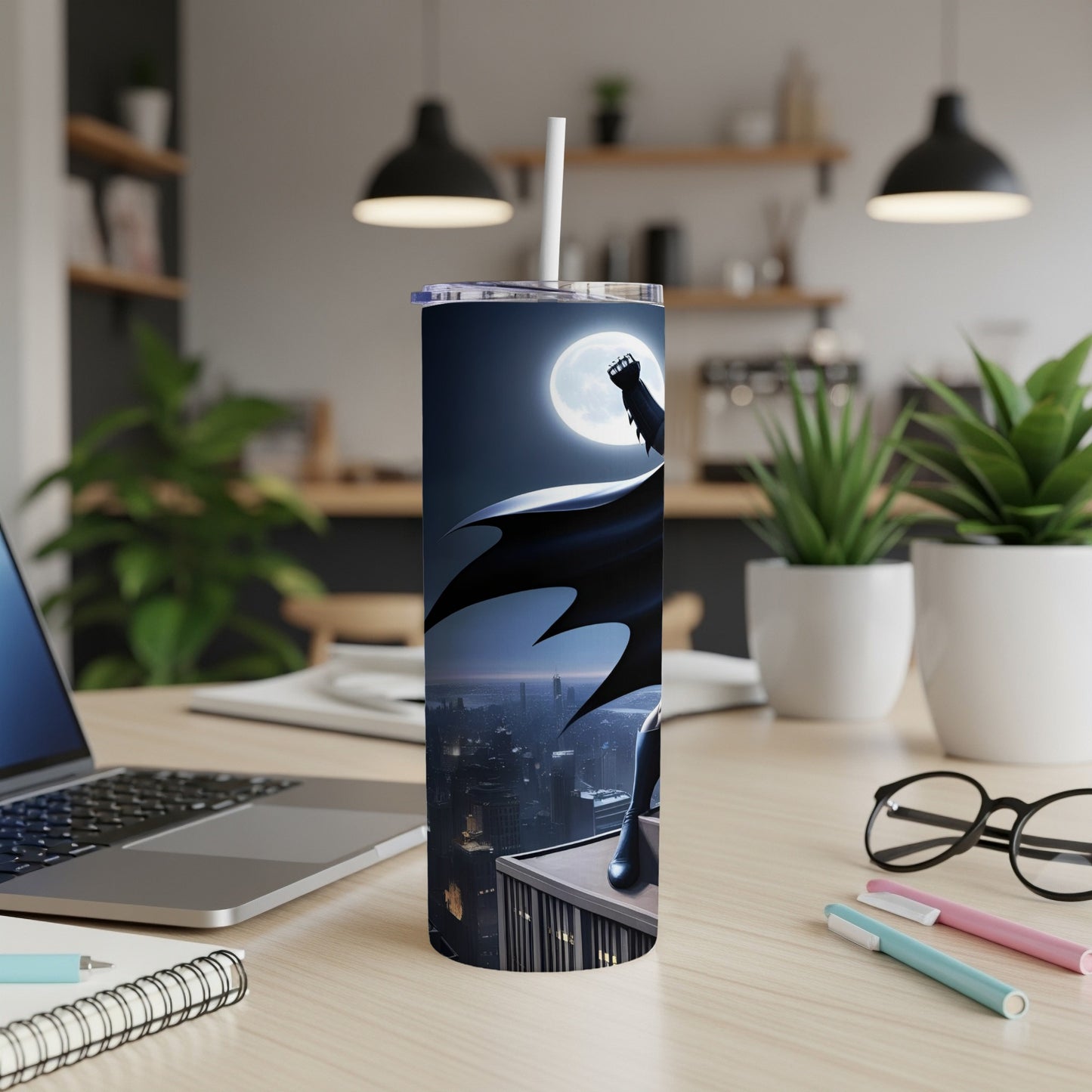 Batman silhouette on skyscraper overlooking city, on a tumbler.