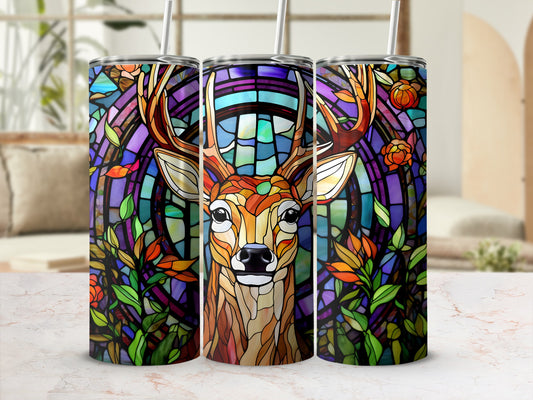 Stained glass deer surrounded by flowers on a colorful, patterned tumbler.