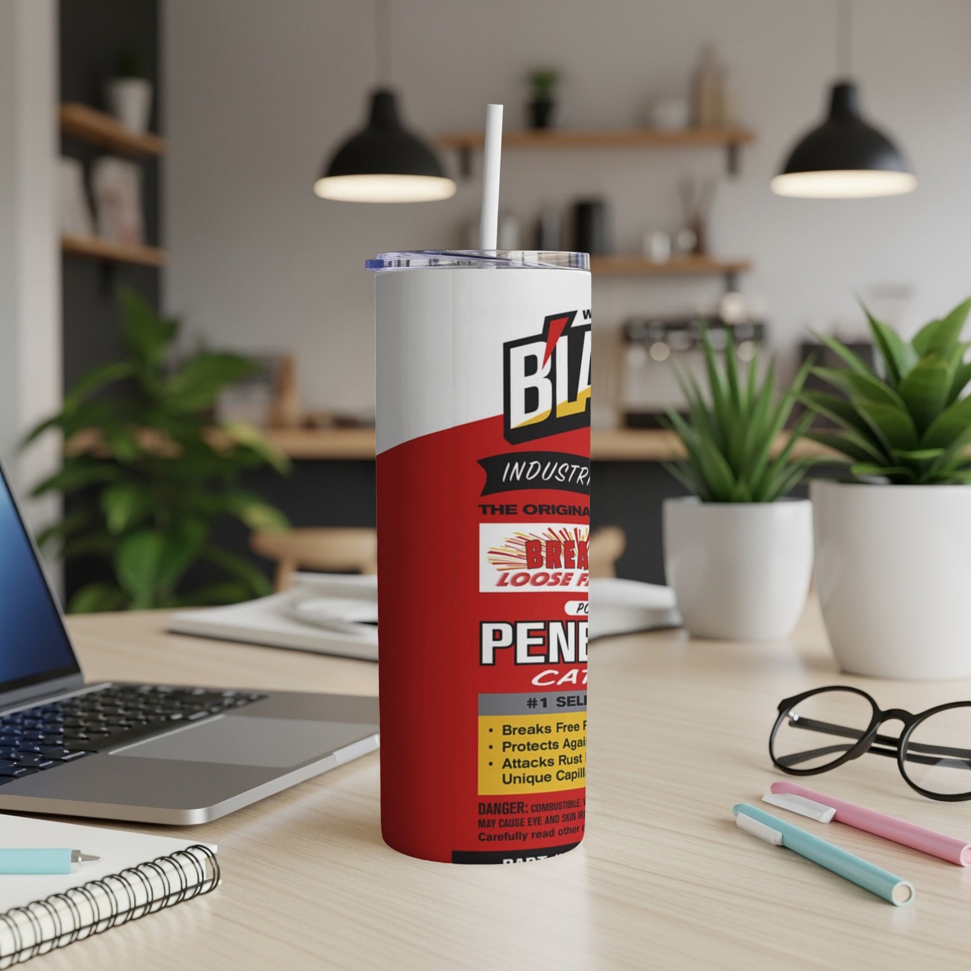 Black and red insulated tumbler with white lid and straw, showing product label.