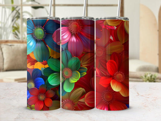 Three tumblers with colorful floral designs arranged on a marble surface.