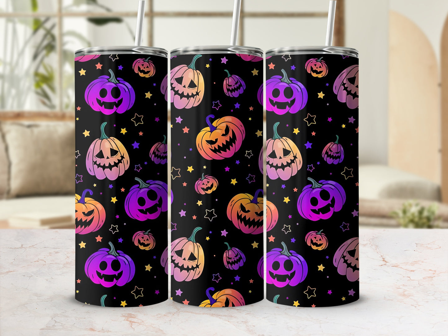 Three tumblers with a black background featuring colorful gradient pumpkins and stars.