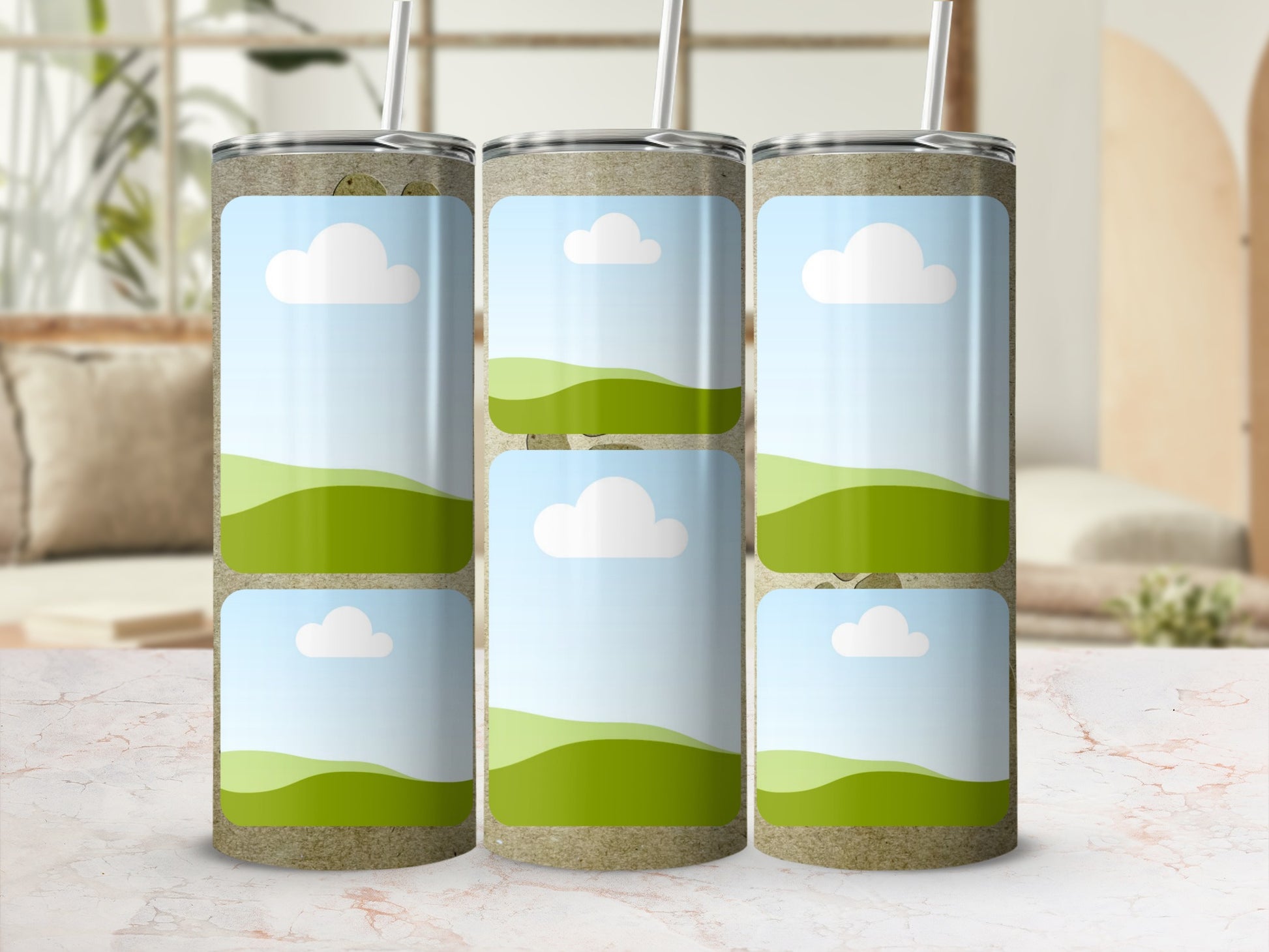 Three tall tumblers with a textured surface and a sky and rolling green hills design.