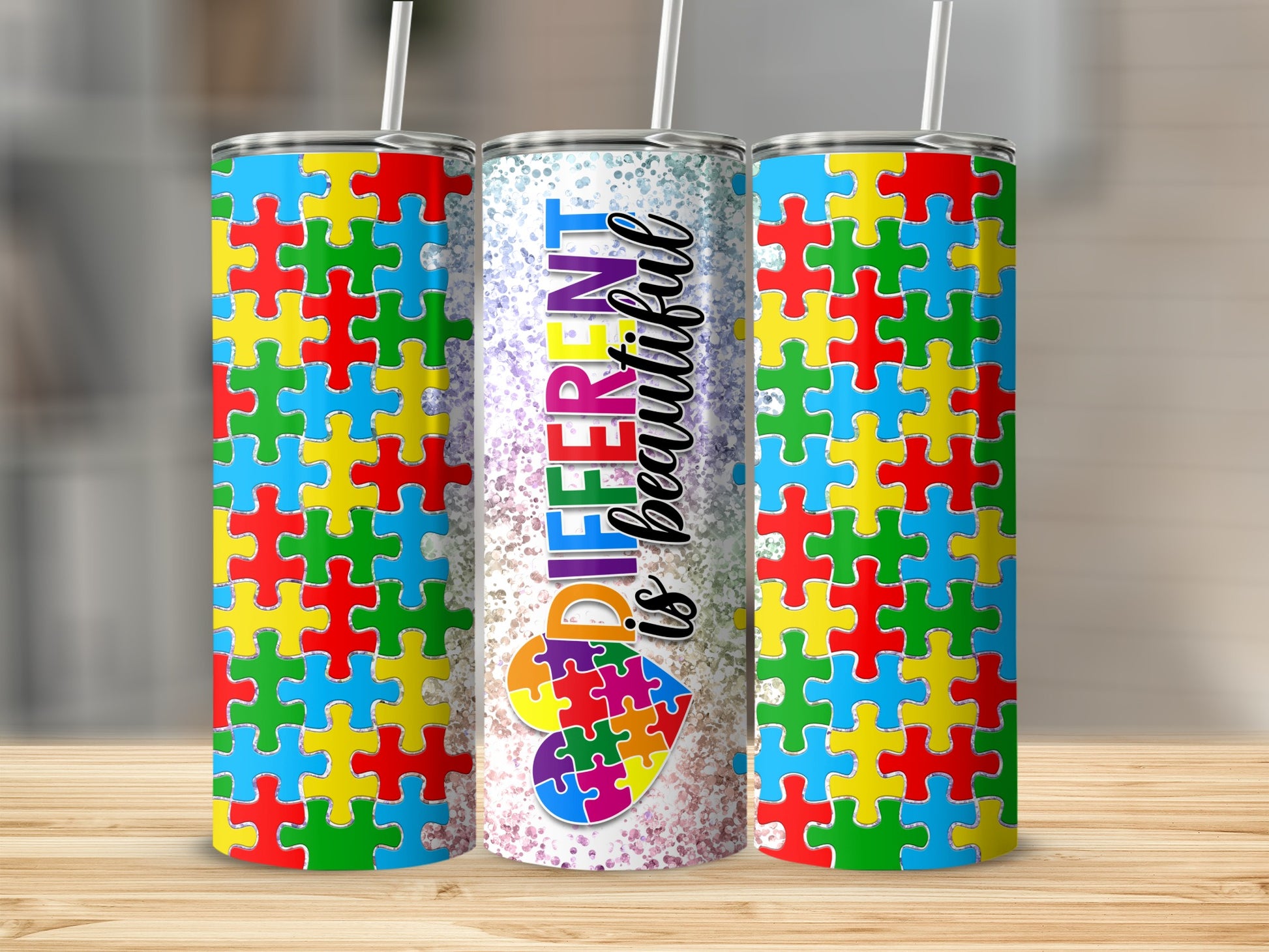 Tumbler with colorful puzzle pieces and "DIFFERENT is BEAUTIFUL" text.
