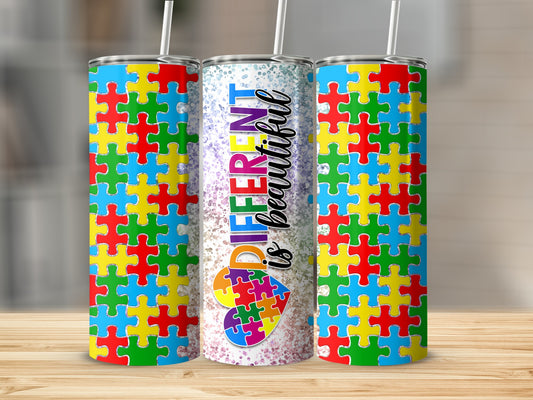 Tumbler with colorful puzzle pieces and "DIFFERENT is BEAUTIFUL" text.