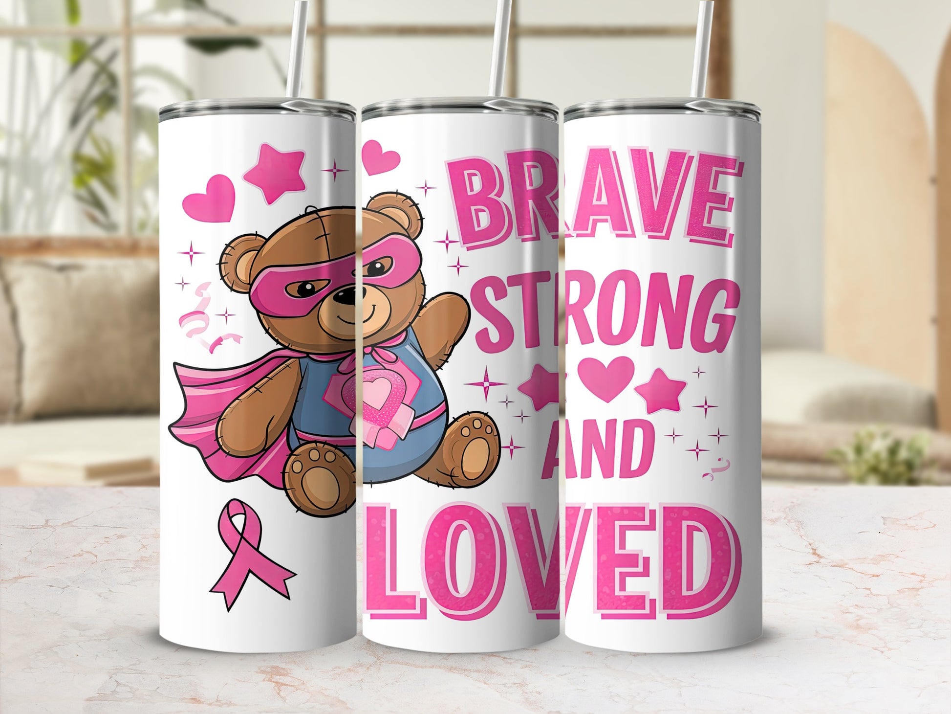 Pink teddy bear superhero and "BRAVE STRONG LOVED" text on tumbler.