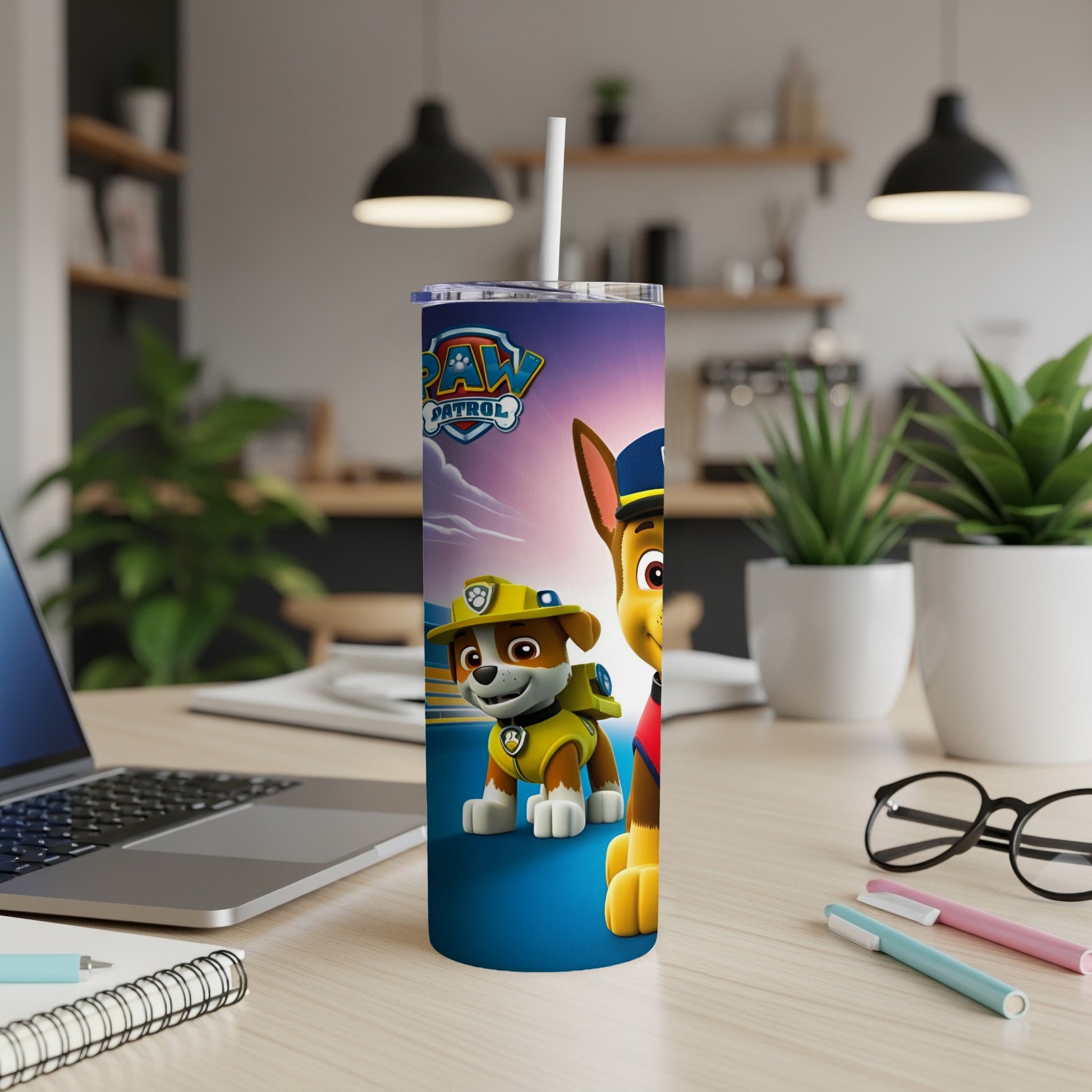 Paw Patrol Chase and Marshall on a blue tumbler with a white straw.
