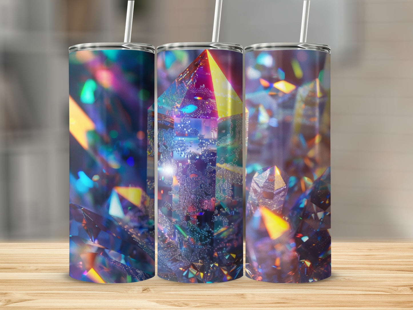 Three tumblers with abstract, iridescent crystal-like patterns and straws.
