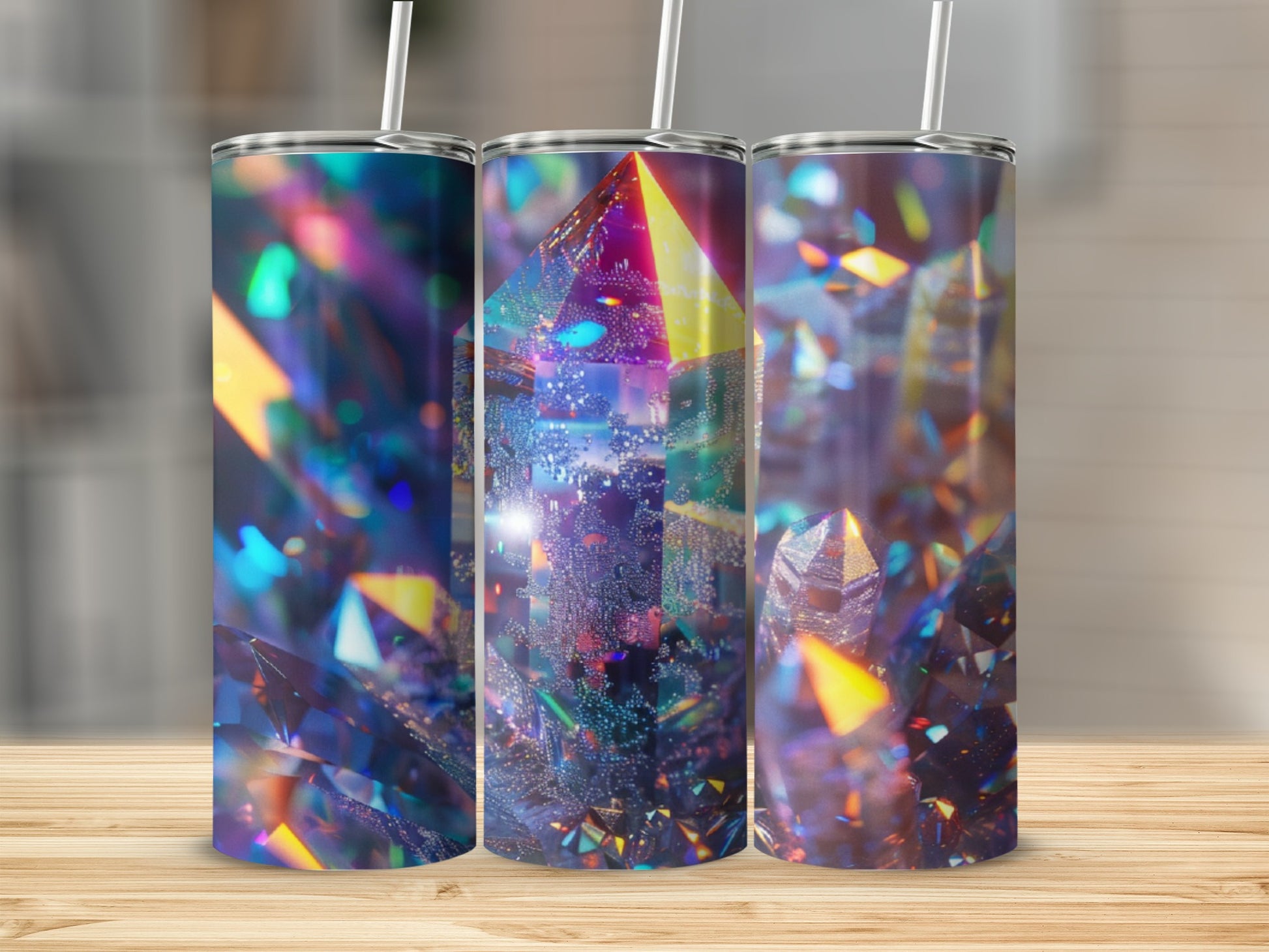 Three tumblers with abstract, iridescent crystal-like patterns and straws.