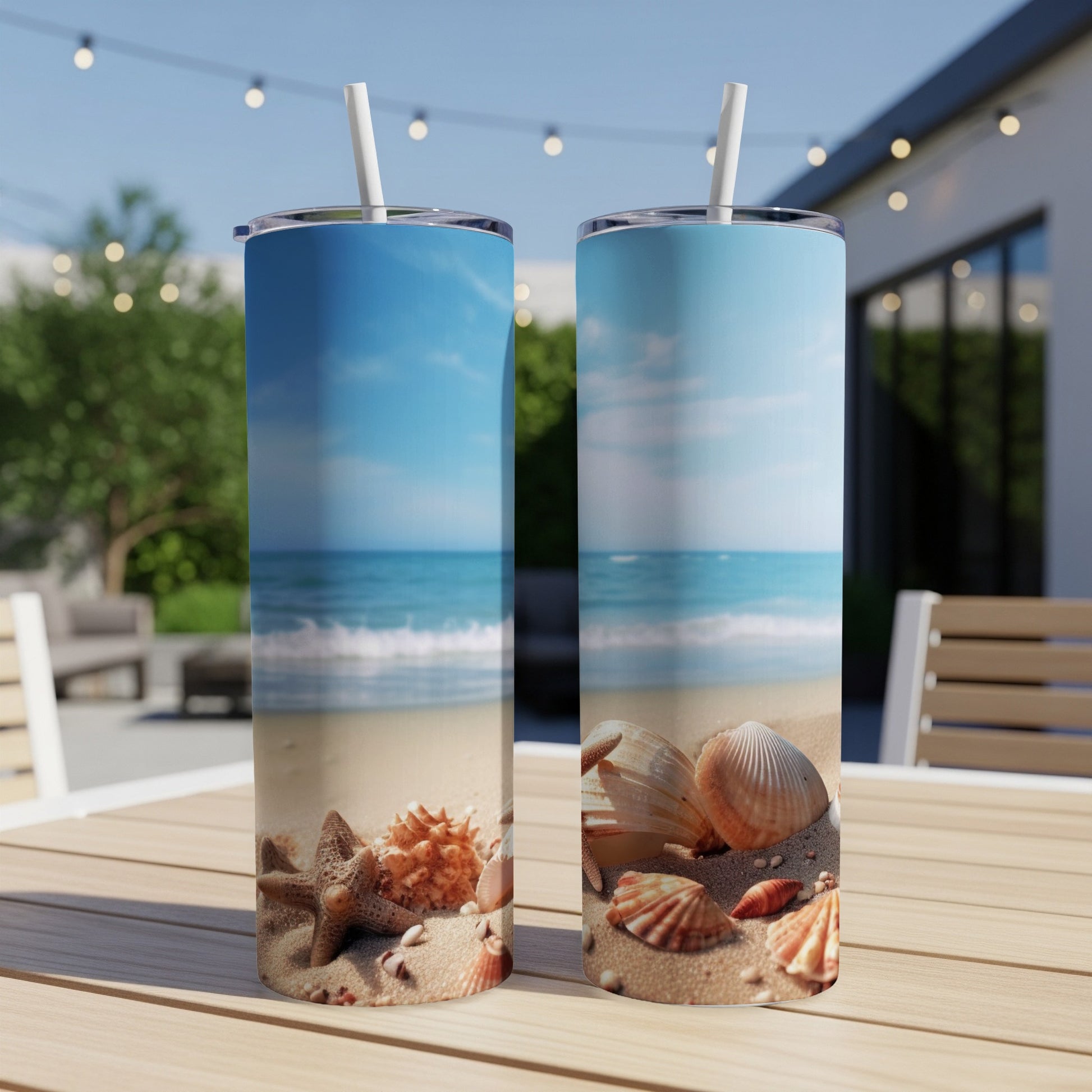 Two tumblers with a beach scene, featuring shells and starfish.