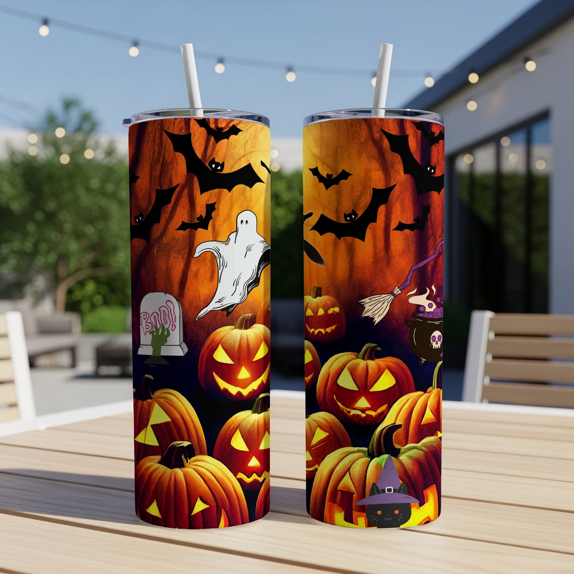 Two Halloween-themed tumblers featuring pumpkins, bats, a ghost, and a black cat.