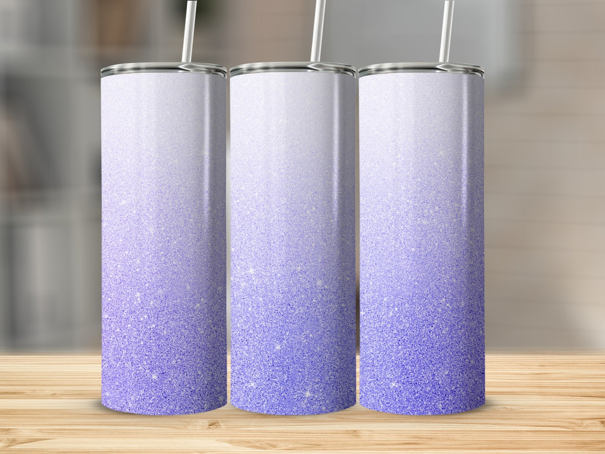 Three tumblers with purple glitter gradient and white straws.