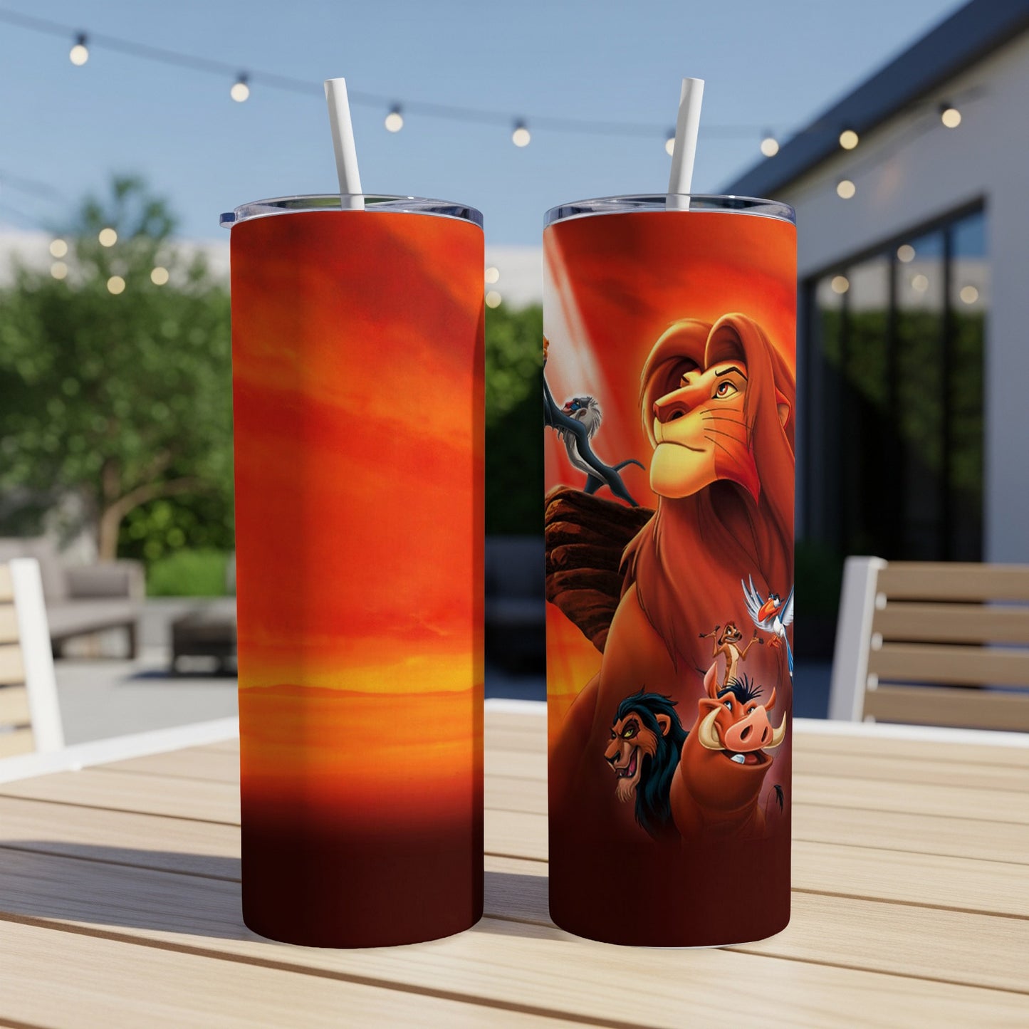The Lion King characters Simba, Timon, and Pumbaa on a sunset-themed tumbler.