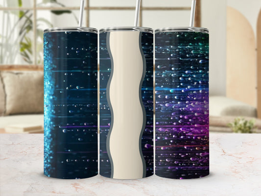 Three insulated tumblers with abstract, colorful, light-streaked designs.