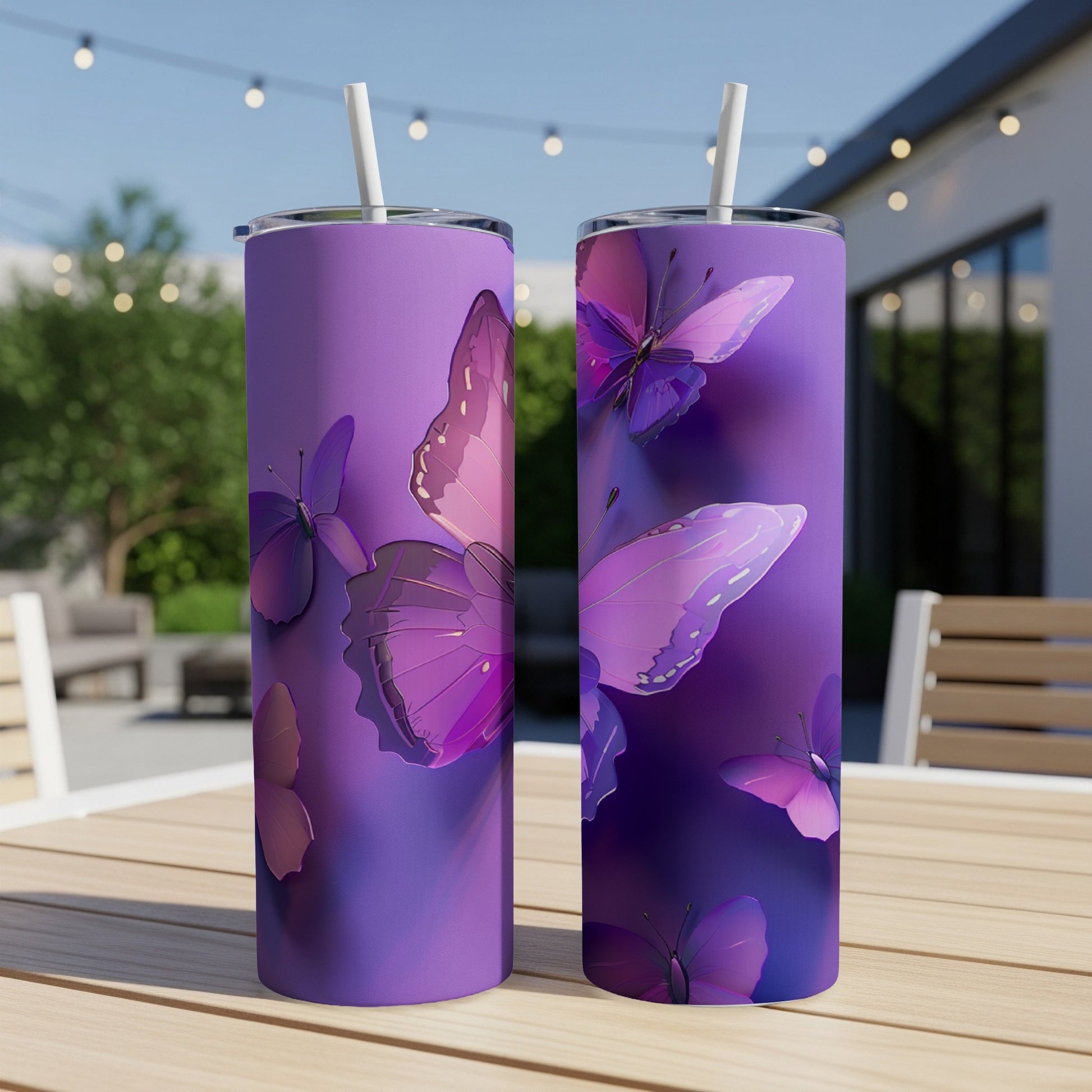 Purple tumblers with pink and purple butterflies on a wooden table.