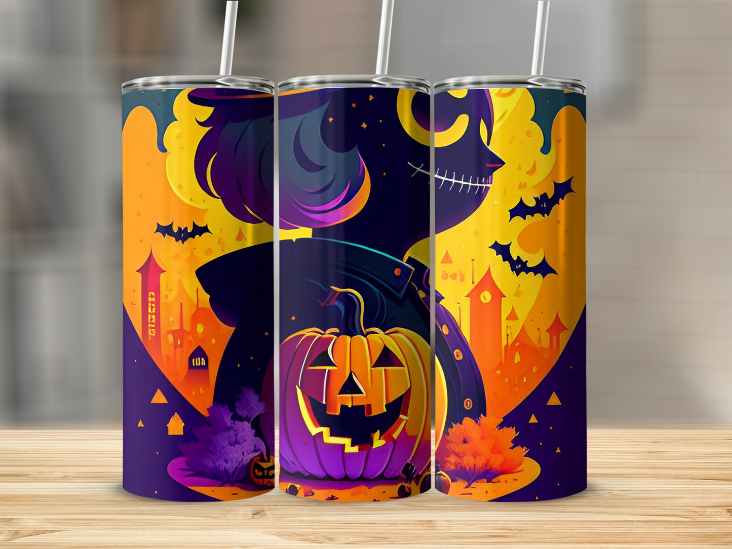 Three tumblers with a Halloween design featuring a skeleton, pumpkin, and spooky castles.