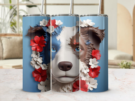Blue tumbler with brown and white dog face adorned with red and white flowers.