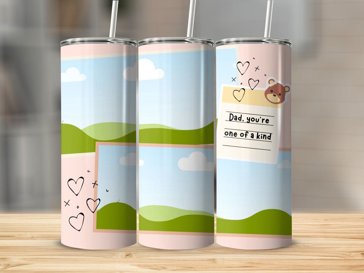 Three tumblers with a sky, clouds, and green hills design, one with text.
