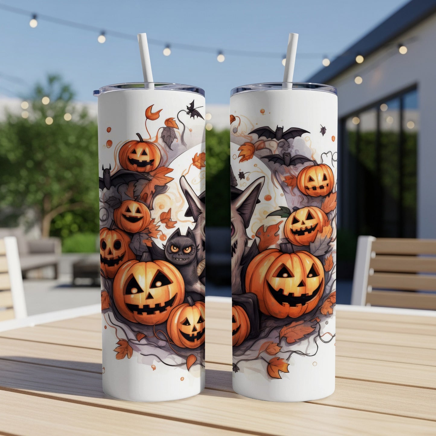 Two tumblers with Halloween theme featuring pumpkins, bats, a cat, and a wolf.