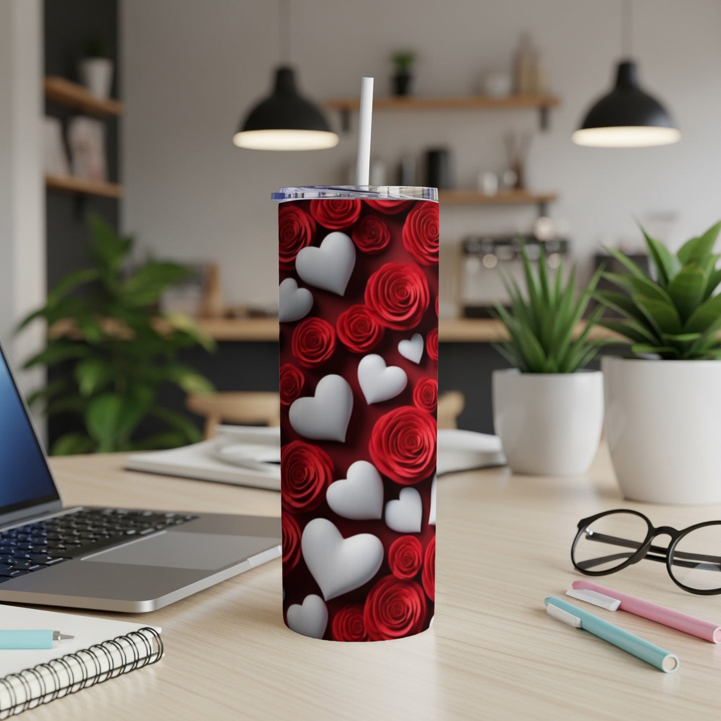 Red roses and white hearts pattern on a stainless steel tumbler.