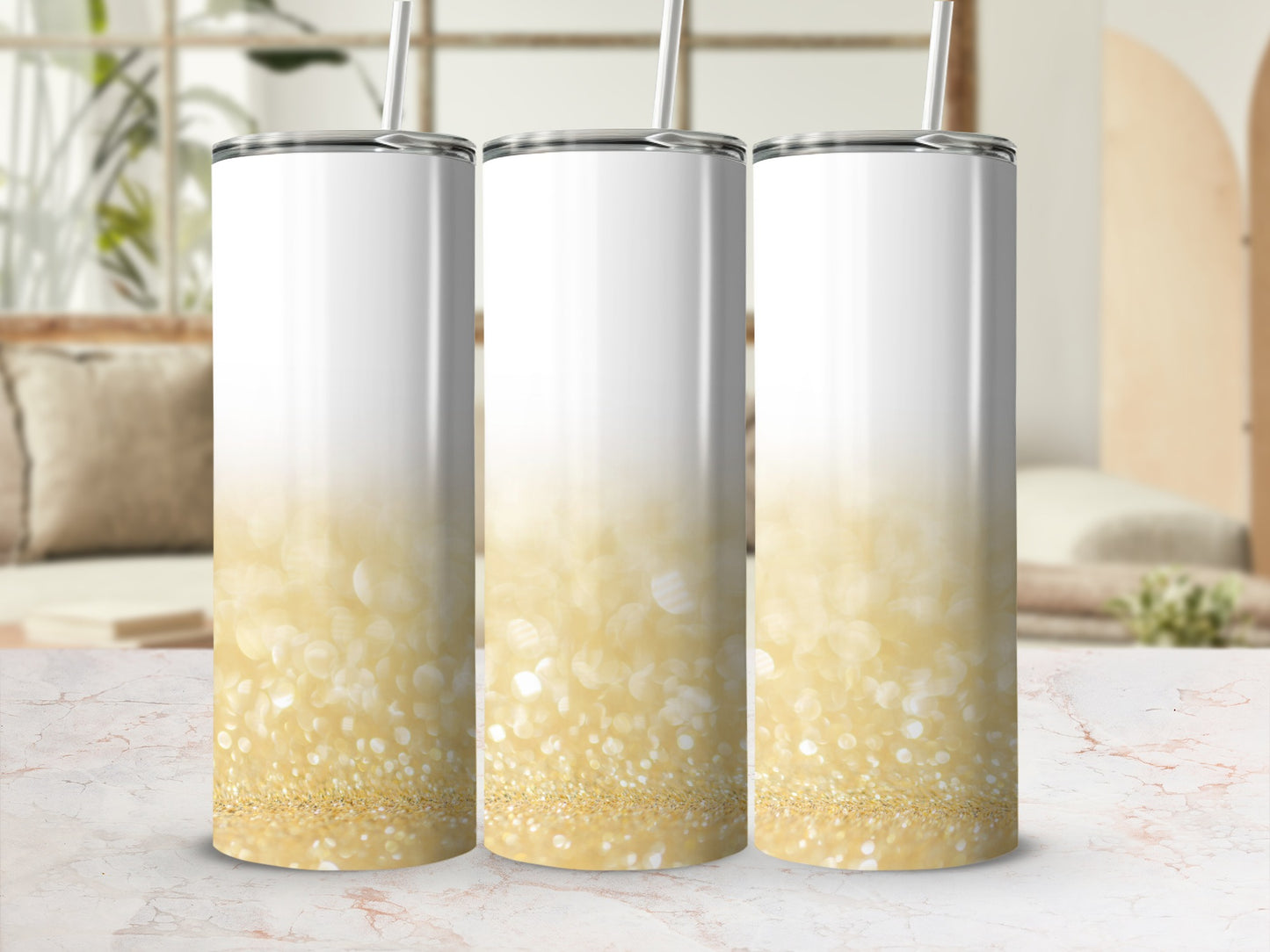 Three white tumblers with gold glitter bokeh gradient and straws.