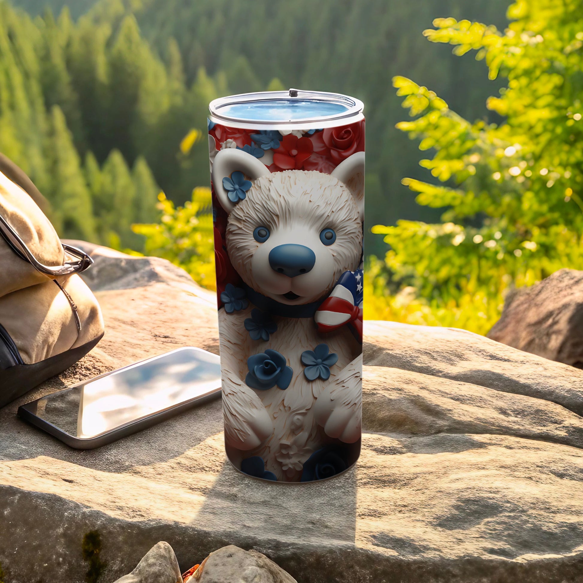 White teddy bear tumbler with blue flowers and American flag accent.