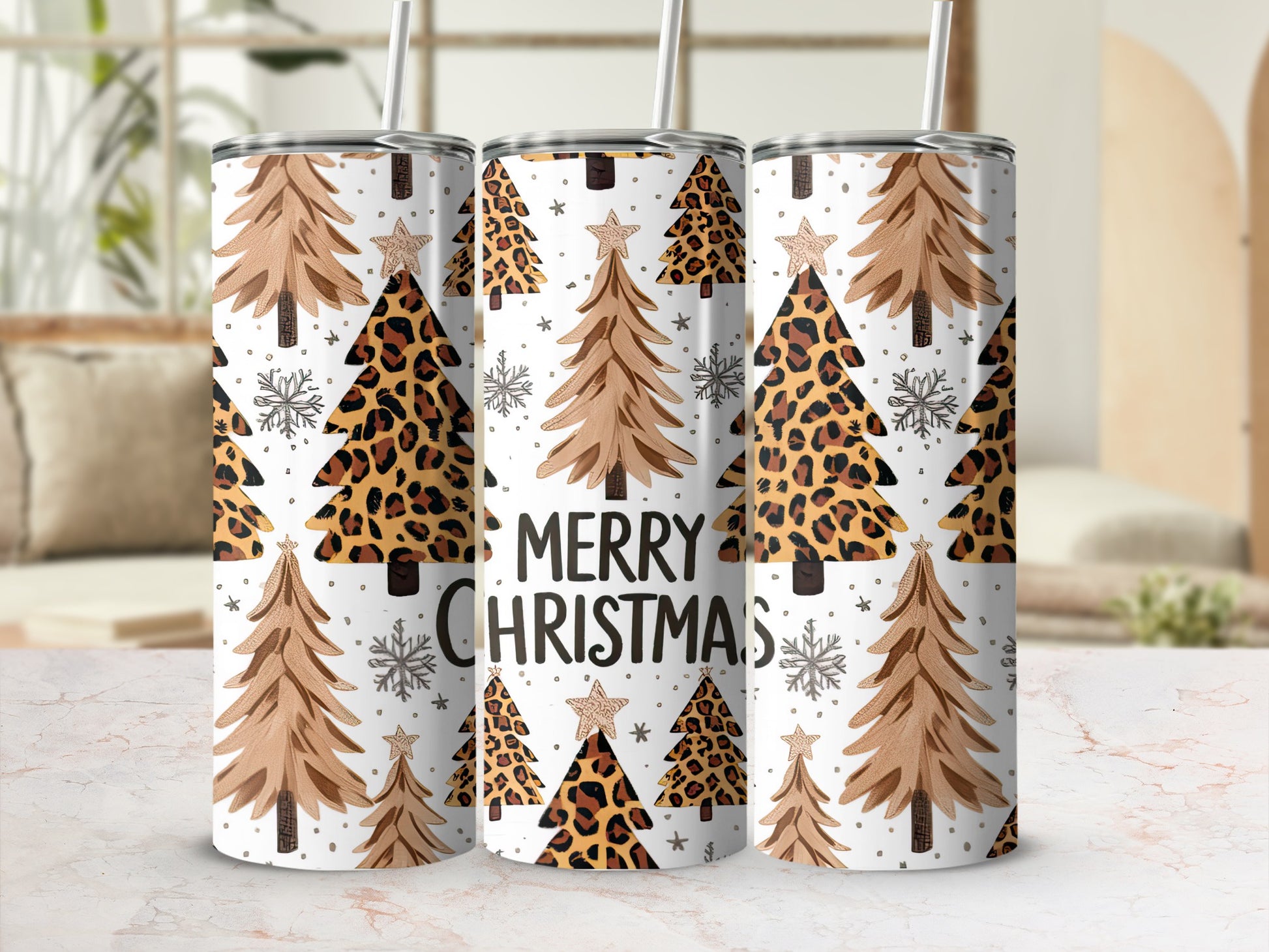 Three tumblers with Christmas trees and leopard print, reading "Merry Christmas".