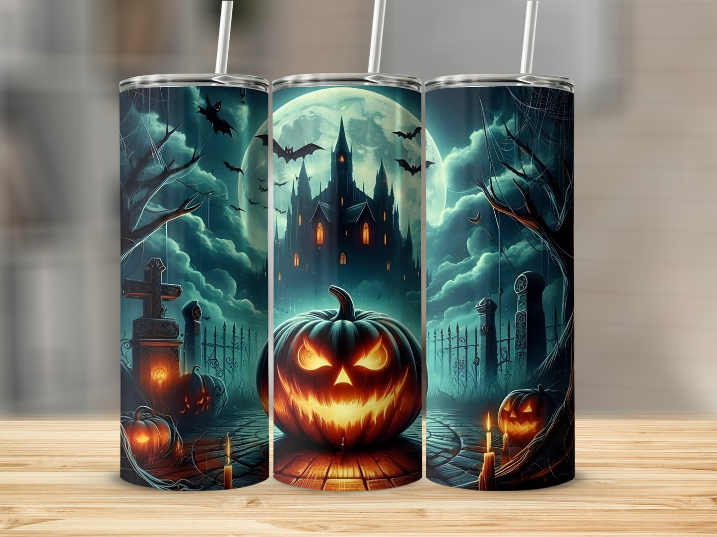 Halloween tumblers featuring a spooky castle, jack-o'-lantern, bats, and graveyard.