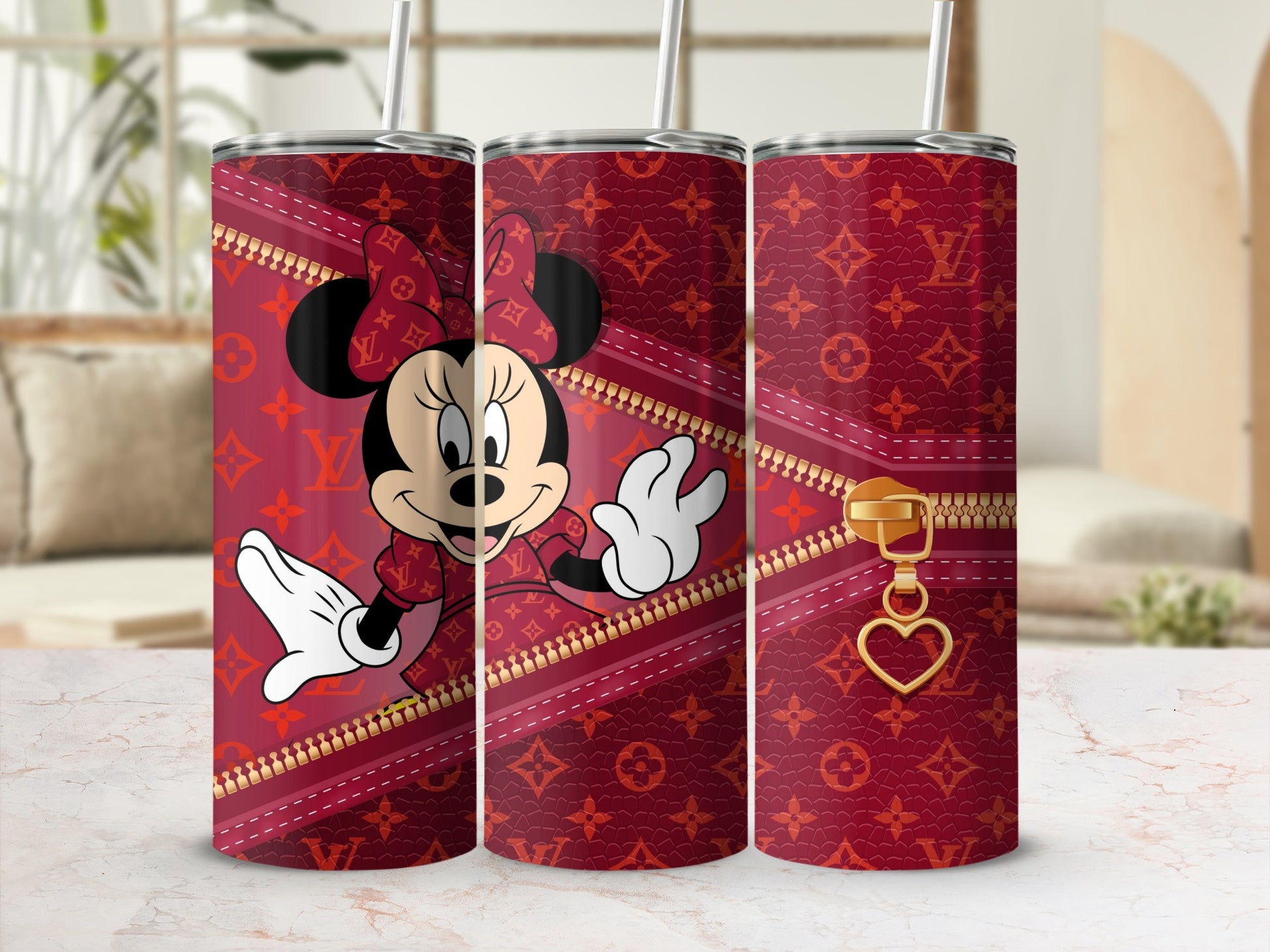 Minnie Mouse on a red zipper tumbler with gold heart zipper pull.