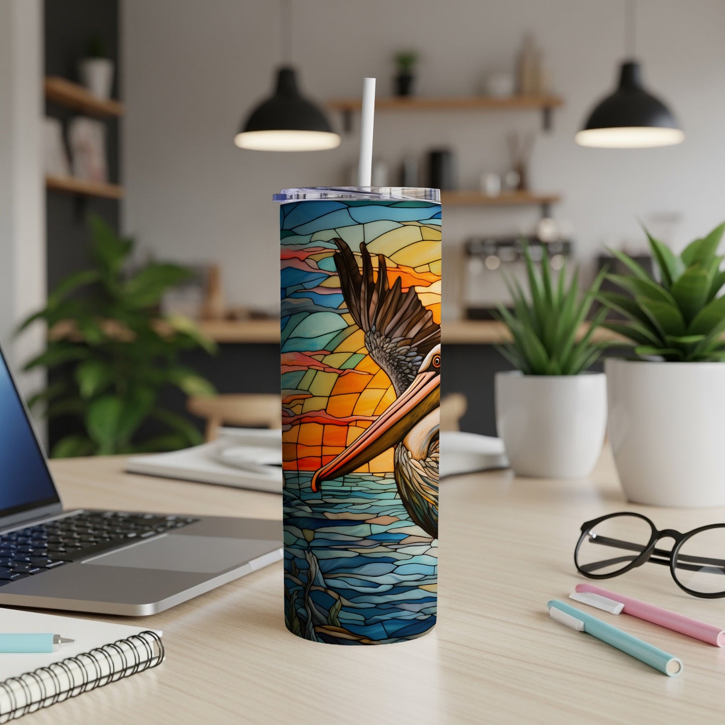 Pelican on stained glass background with sunset over water, on a tumbler.