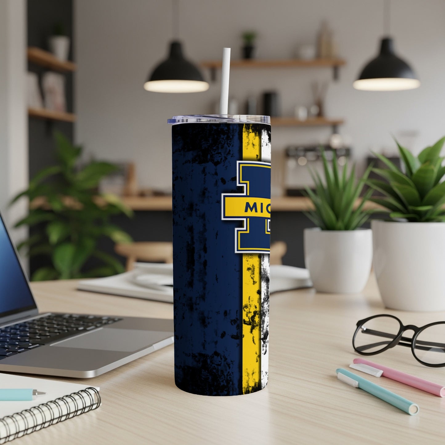 Tumbler with distressed navy, yellow, and white design featuring "MICHIGAN" text.