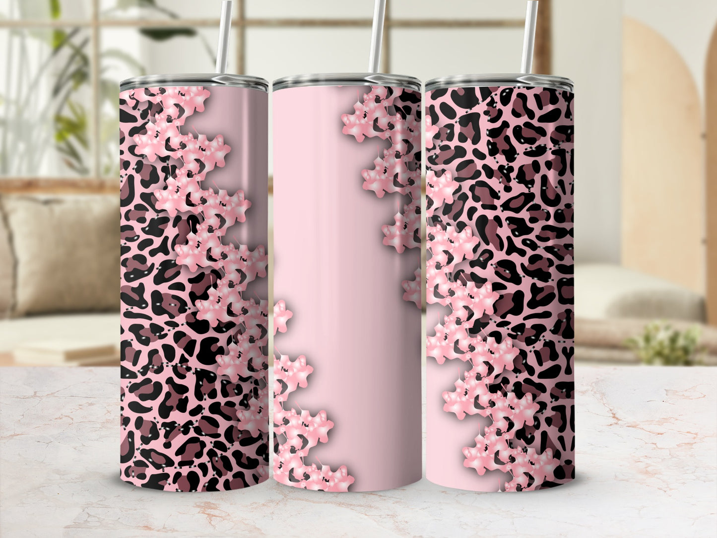 Pink leopard print tumbler with floral accents and straw.