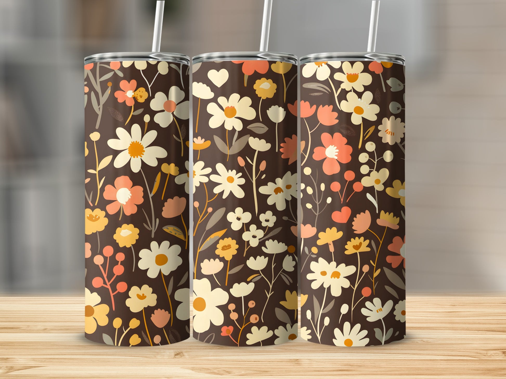 Three brown tumblers with a repeating floral pattern of white, orange, and yellow flowers.