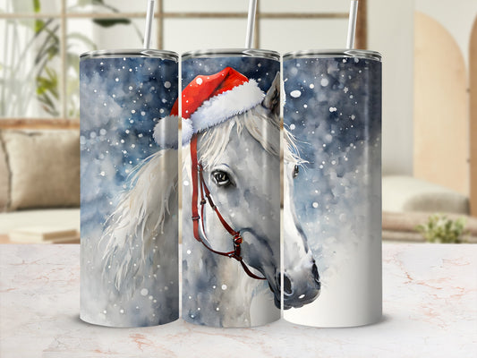 White horse wearing a Santa hat on a snowy tumbler.