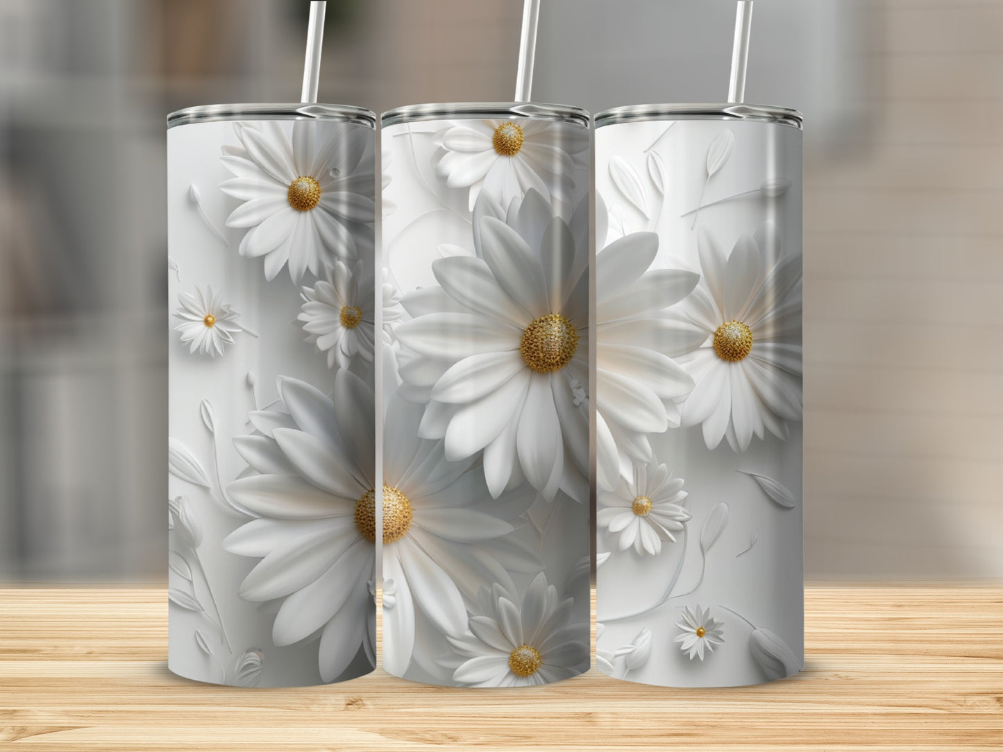 Three white tumblers with embossed daisies on a wooden surface.