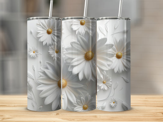 Three white tumblers with embossed daisies on a wooden surface.