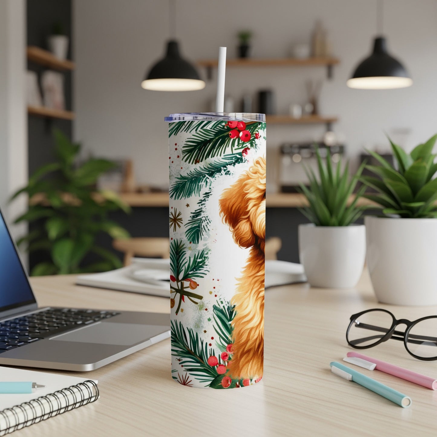 Golden doodle on a tumbler with festive evergreen and berry design.