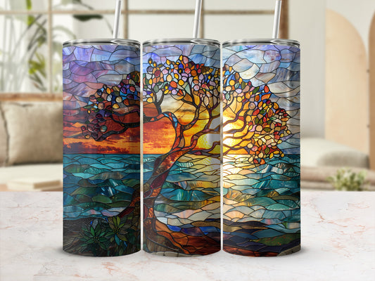 Stained glass tree with sunset over water on three tumblers.