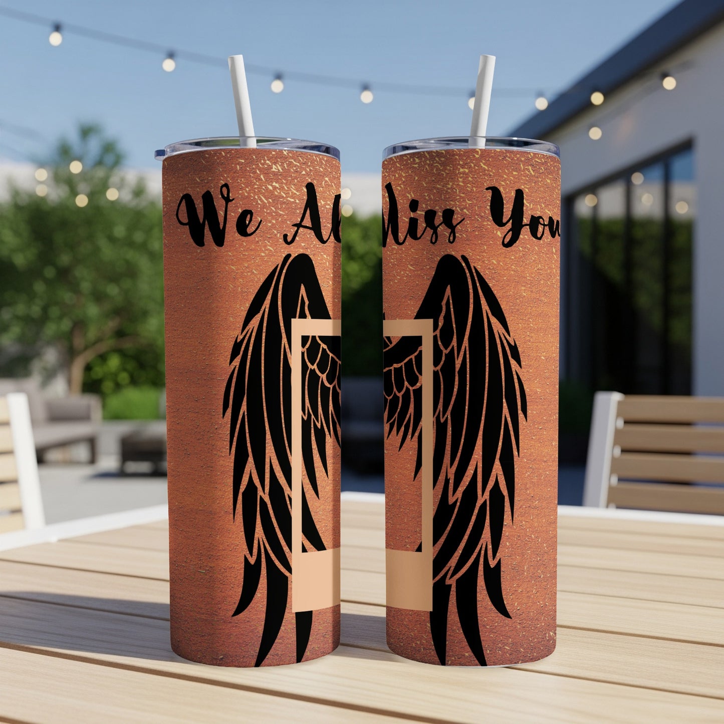 Two tumblers with "We All Miss You" and angel wings designs.