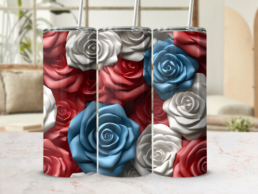 Three tumblers with red, white, and blue rose designs and straws.