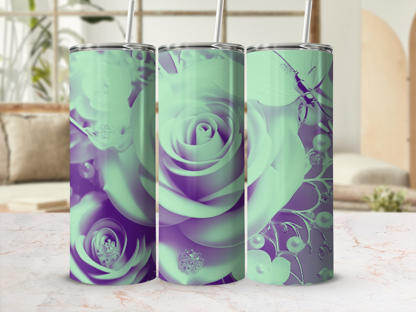 Three mint green and purple floral tumblers with floral designs.