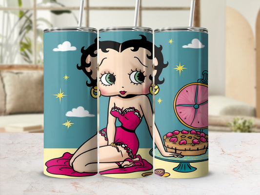 Betty Boop in a pink dress sitting next to a cake with a clock background.