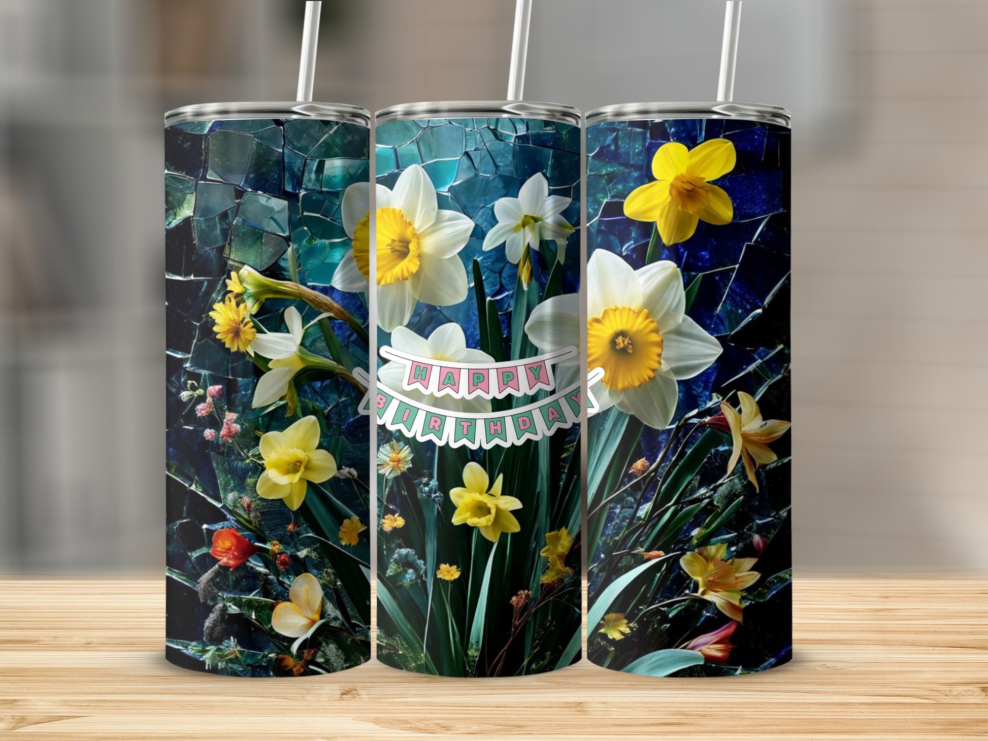 Three tumblers with daffodils and a "Happy Birthday" banner.