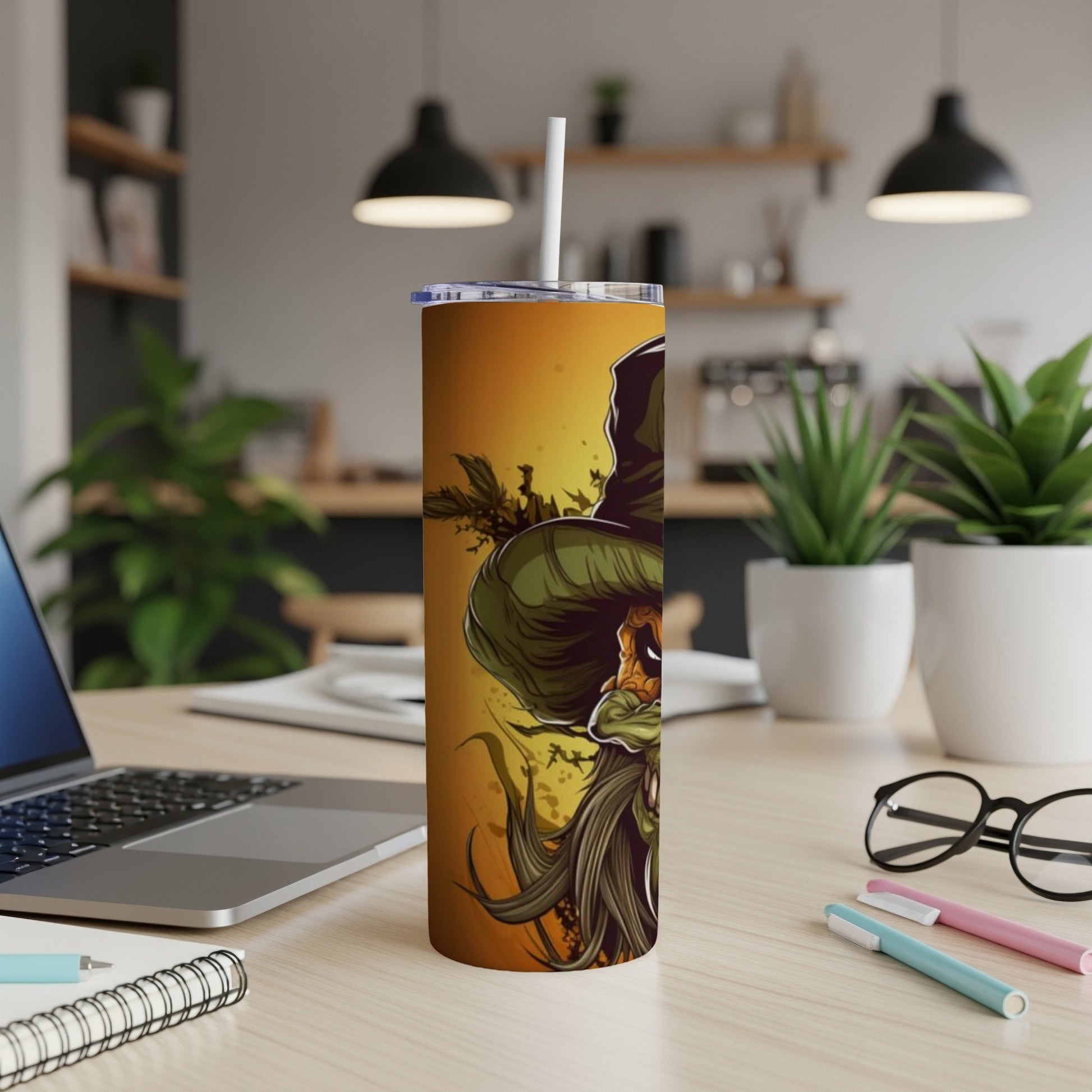 Halloween pumpkin character on a yellow tumbler with a straw.