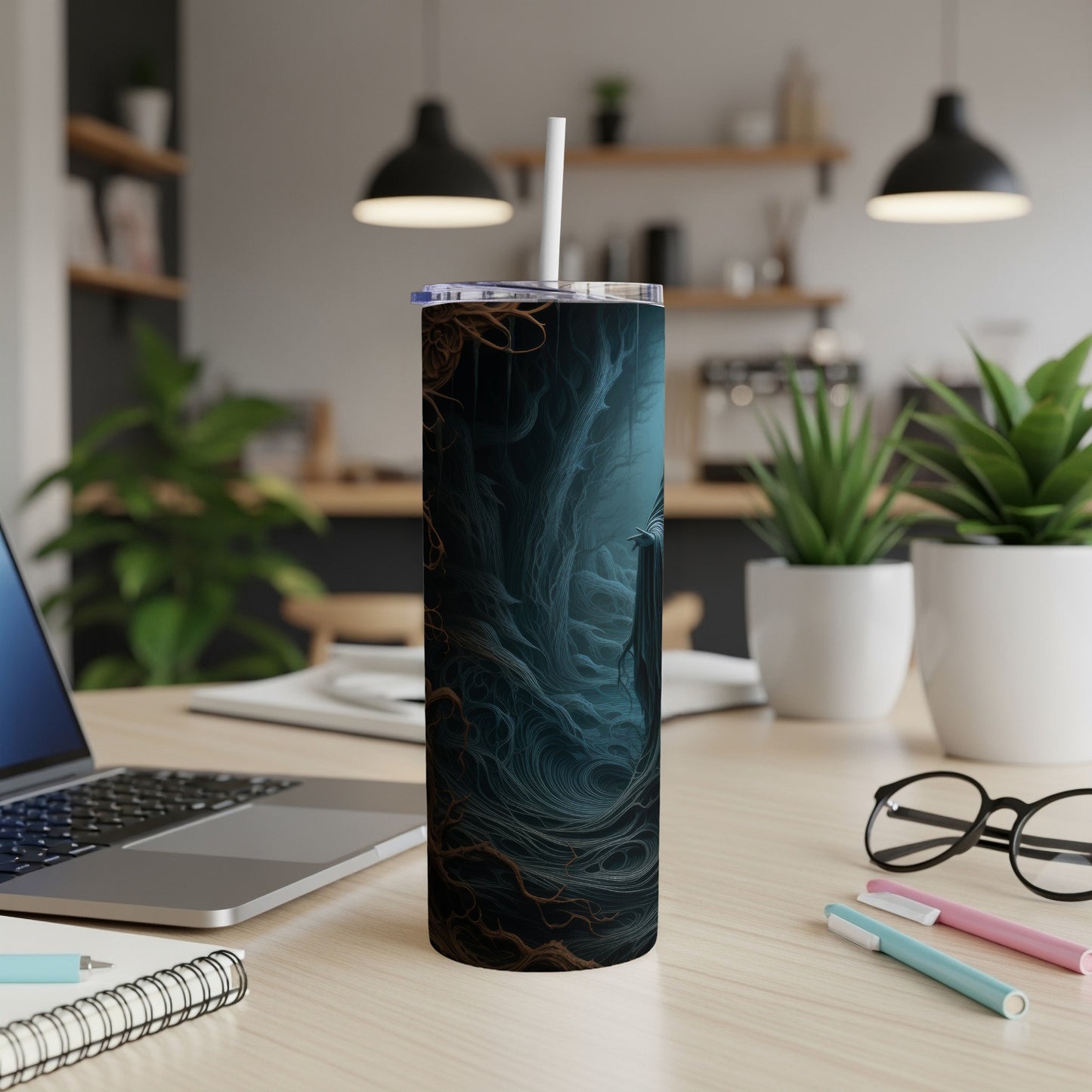 Tumbler with dark, abstract forest design and a white straw.